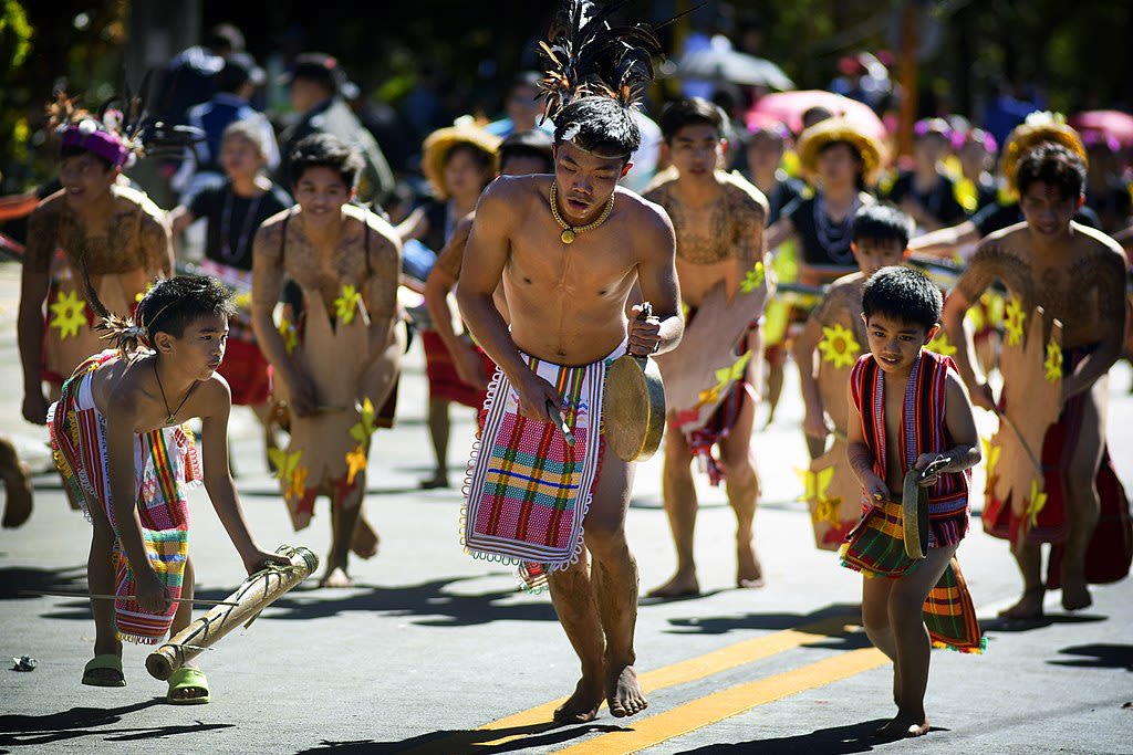 Igorot men and boys dancing the traditional Igorot dance