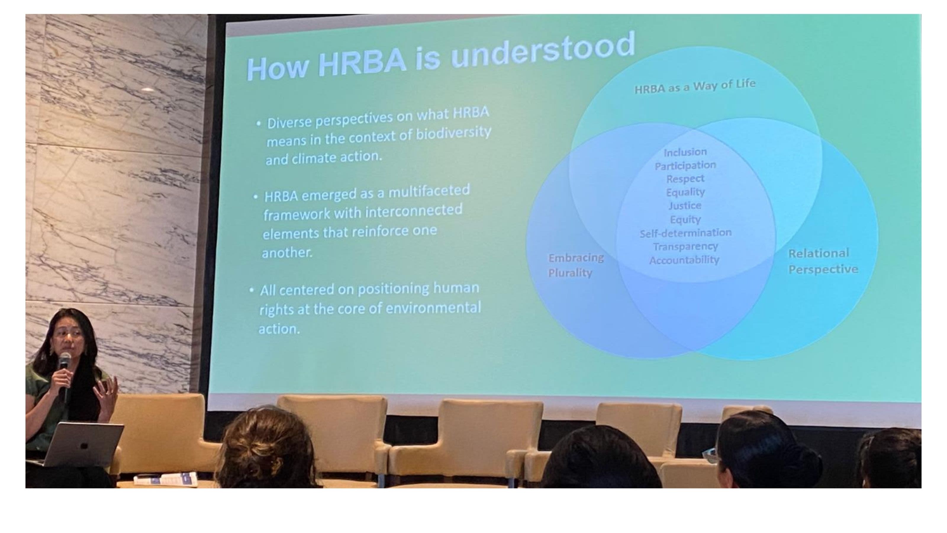 A presenter explains how the Human Rights-Based Approach (HRBA) is understood in the context of biodiversity and climate action during the “Inclusive Conversations” event.
