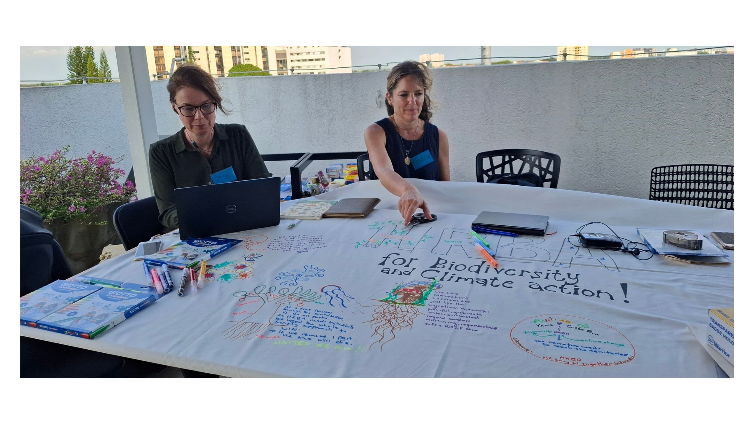 A participant contributes to a collaborative poster during the Multi-Actor Dialogue in Cali, Colombia (October 2024), which explored the links between biodiversity, climate change and human rights.