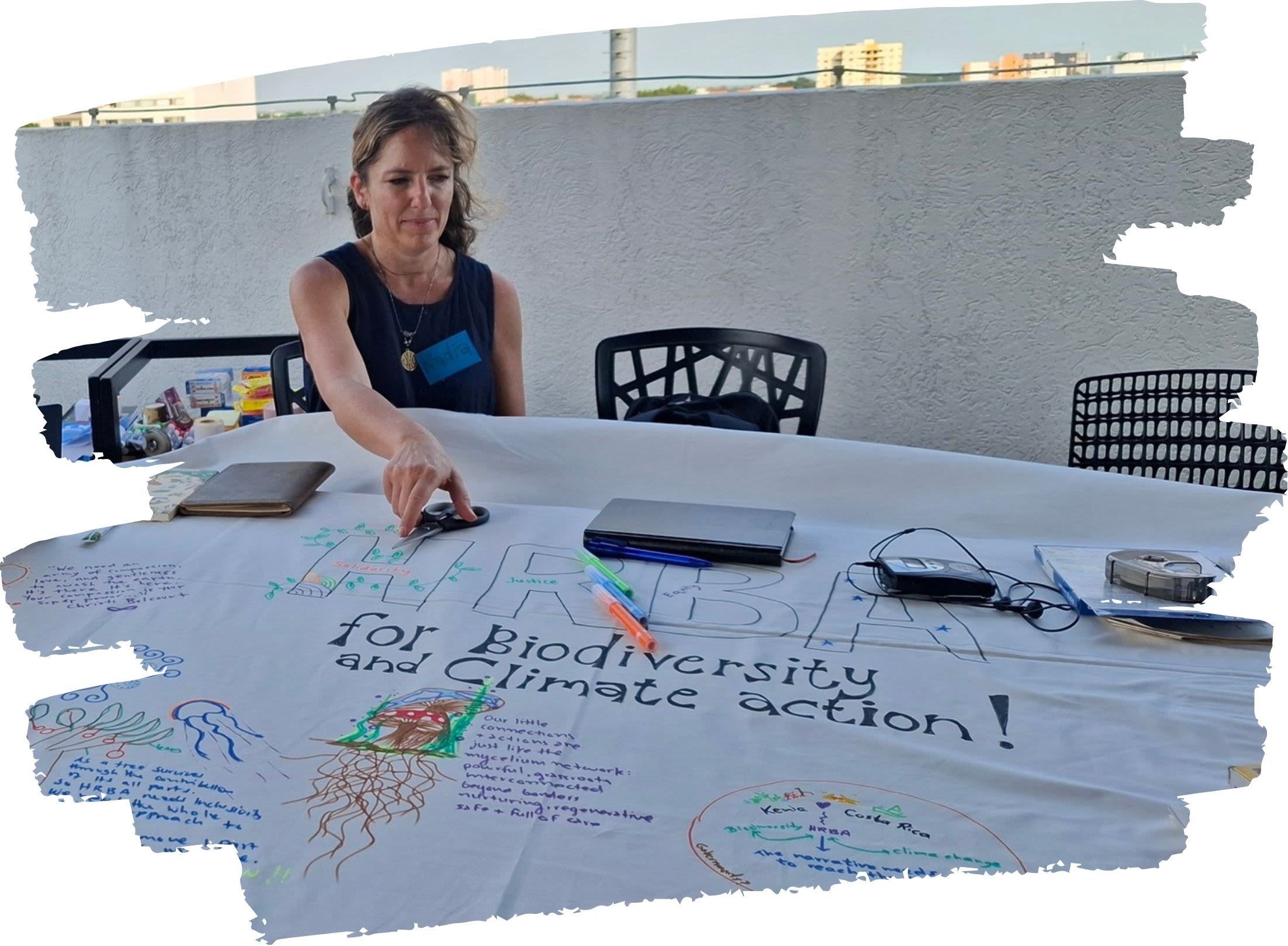 A participant contributes to a collaborative poster during the Multi-Actor Dialogue in Cali, Colombia (October 2024), which explored the links between biodiversity, climate change and human rights.