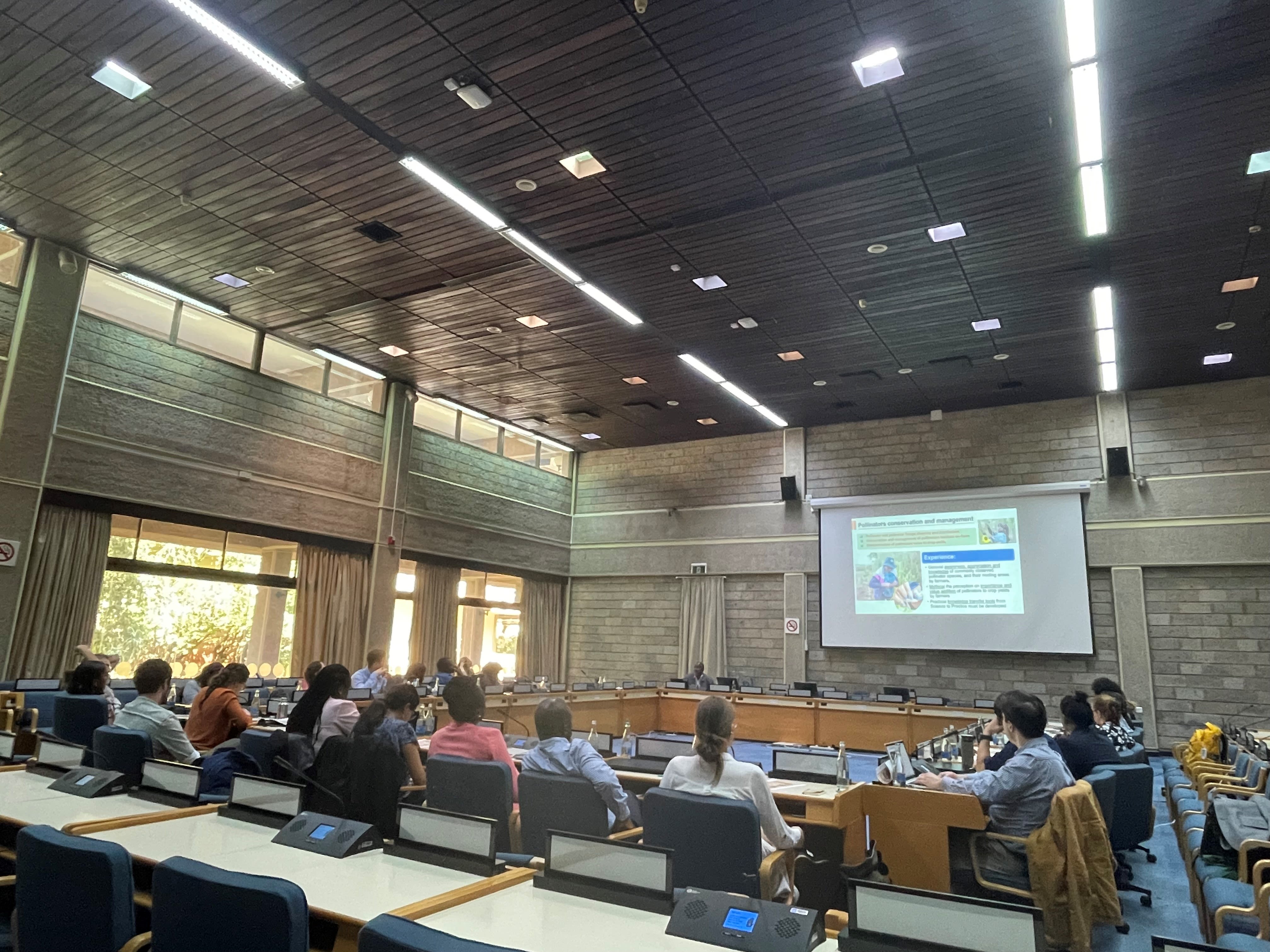 Participants of the IPBES Fellows Annual Training Workshop & Capacity-Building Forum gathered in a conference room