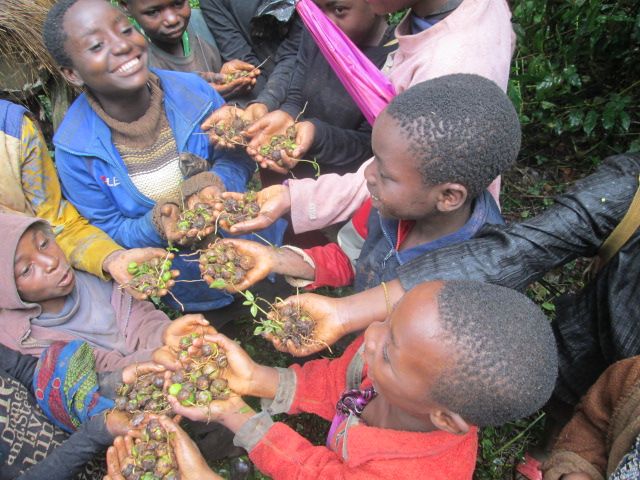 Group of children holding fruits