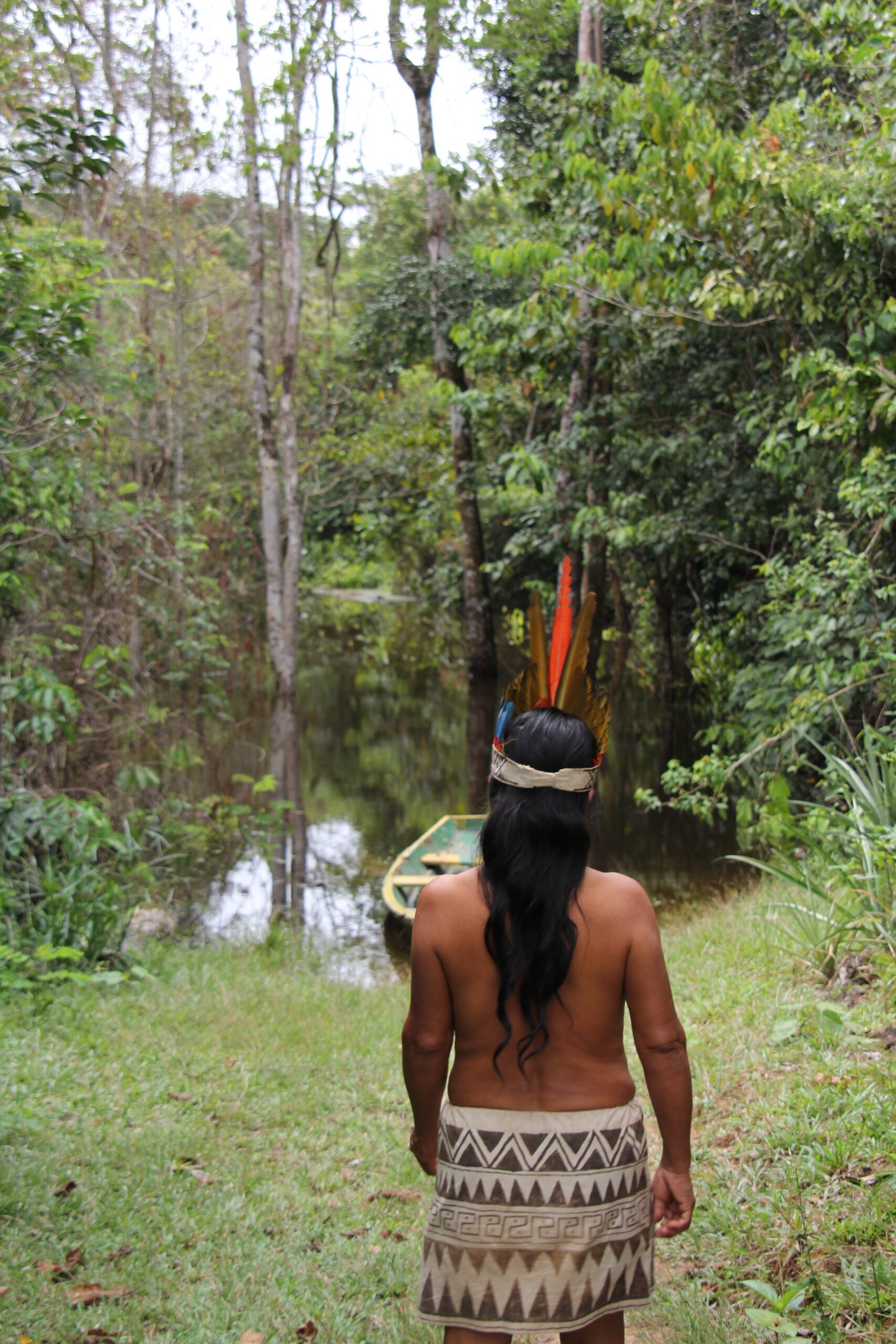 A native man in a forest.
