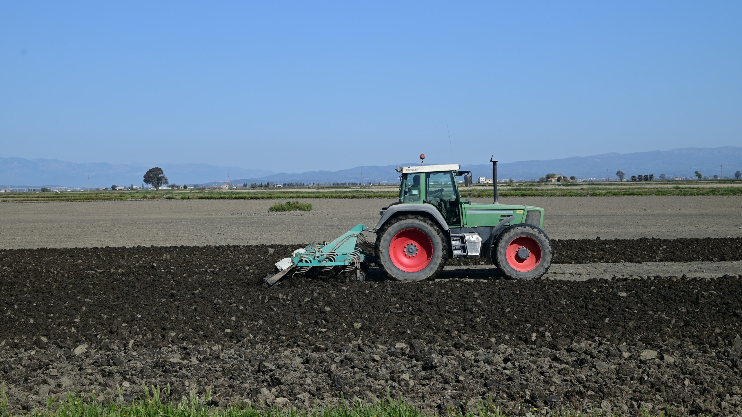 Photo of a tractor ploughing a field