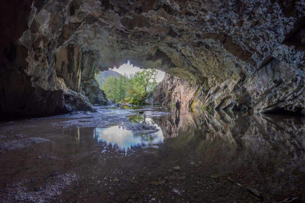 Photo of a cave with water inside