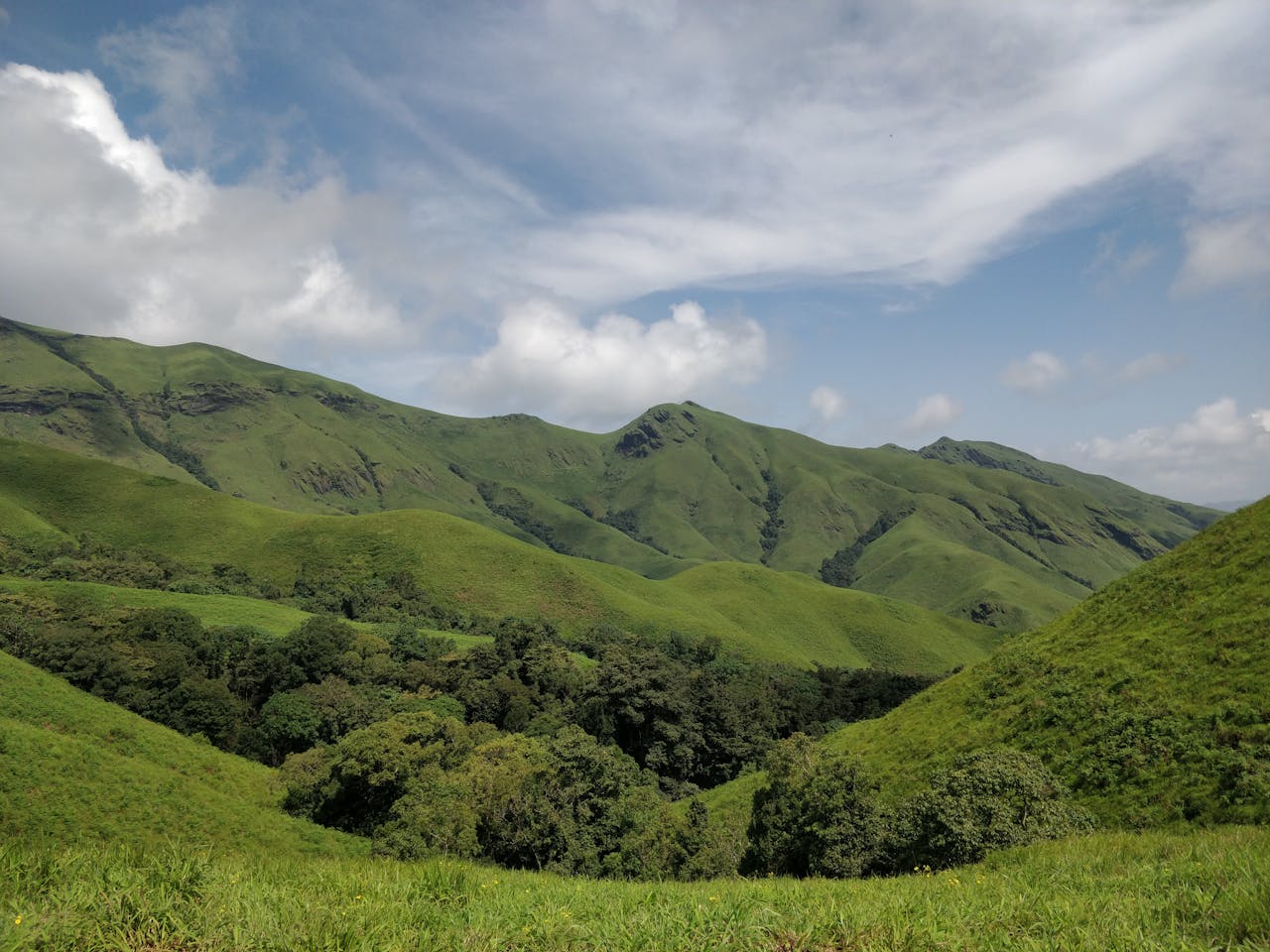 lush green hills of Kudremukha in Karnataka, offering breathtaking natural beauty and tranquility