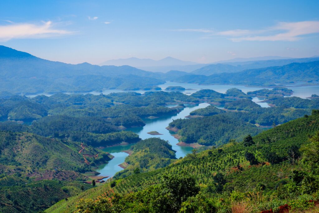 Stunning aerial view of lush green mountains and winding rivers in Vietnam