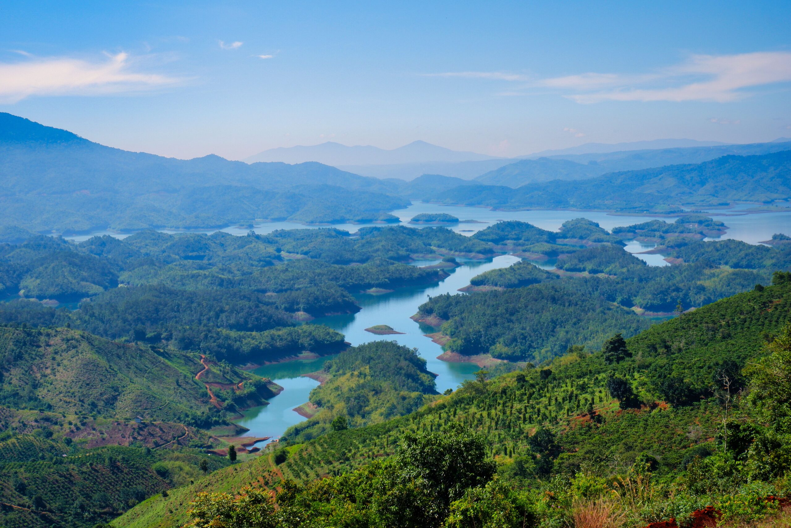 Stunning aerial view of lush green mountains and winding rivers in Vietnam